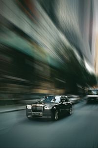 Превью обои rolls-royce, автомобиль, черный, улица, скорость, размытость