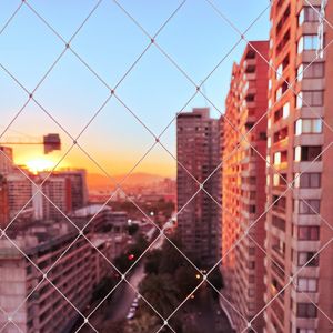 Превью обои сетка, здания, город, закат, вид