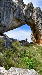 Превью обои скала, арка, трава, камни, природа