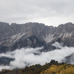 Превью обои скала, горы, облака, деревья, лес