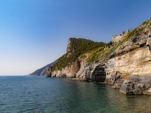 Превью обои скала, утес, море, деревья, небо