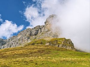 Превью обои скала, утес, туман, облака, трава