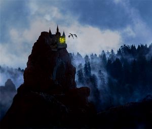 Превью обои скала, замок, дракон, туман, лес