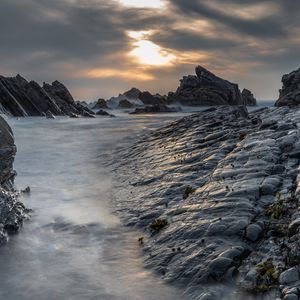 Превью обои скалы, берег, вода, закат, пейзаж