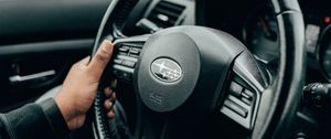 Превью обои subaru, автомобиль, руль, руки, черный