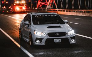 Превью обои subaru wrx, subaru, автомобиль, спорткар, вид спереди, дорога, иероглифы