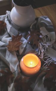 Превью обои свеча, листья, осень, ткань, пламя