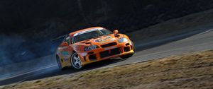 Превью обои toyota supra, toyota, автомобиль, оранжевый, дрифт, скорость