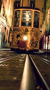 Превью обои трамвай, рельсы, вечер, граффити, улица