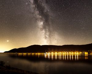 Превью обои туманность, звездное небо, звезды, пристань, огни, ночь