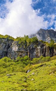 Превью обои утес, скала, трава, облака