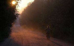 Превью обои велосипед, ребенок, девочка, катание, дорога, лес, солнечный свет