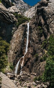 Превью обои водопад, камни, скалы, ветки, утес