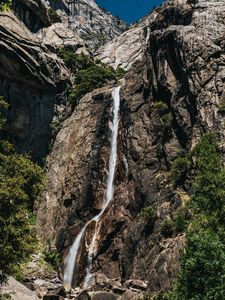 Превью обои водопад, камни, скалы, ветки, утес