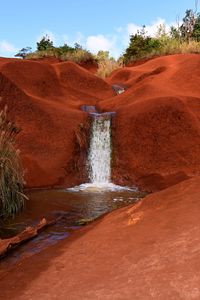 Превью обои водопад, река, песок, кусты, небо