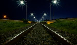 Превью обои железная дорога, фонари, свет, гравий