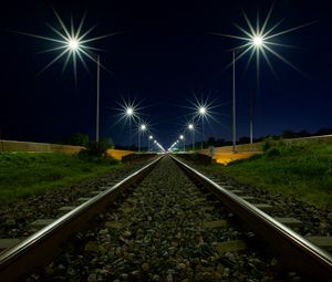 Превью обои железная дорога, фонари, свет, гравий